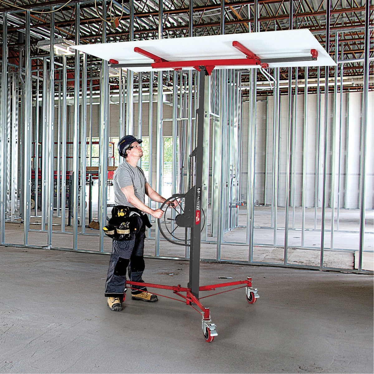 BuildMan MP912 lift installed holding drywall panel on jobsite