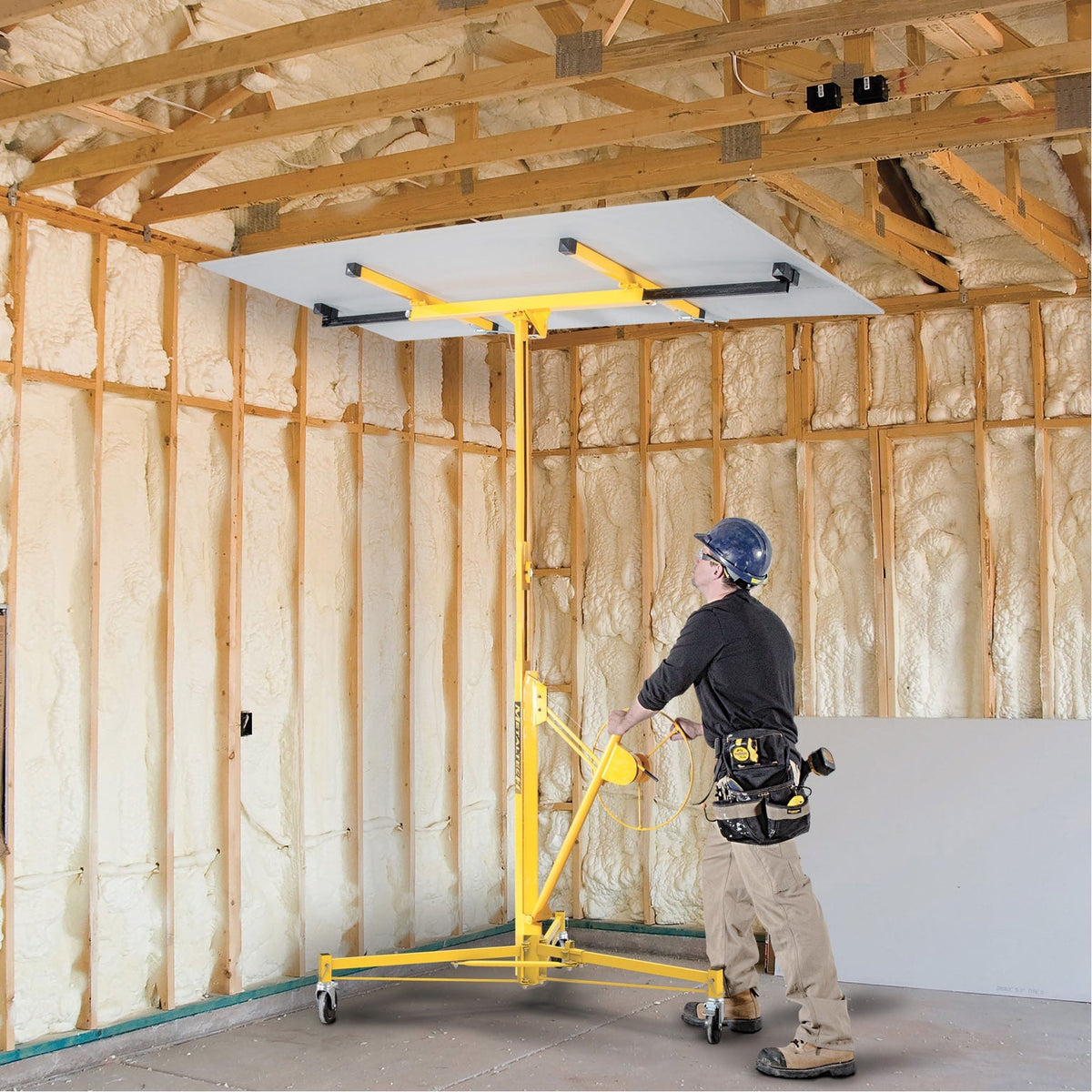 MP911 hoisting drywall at ceiling